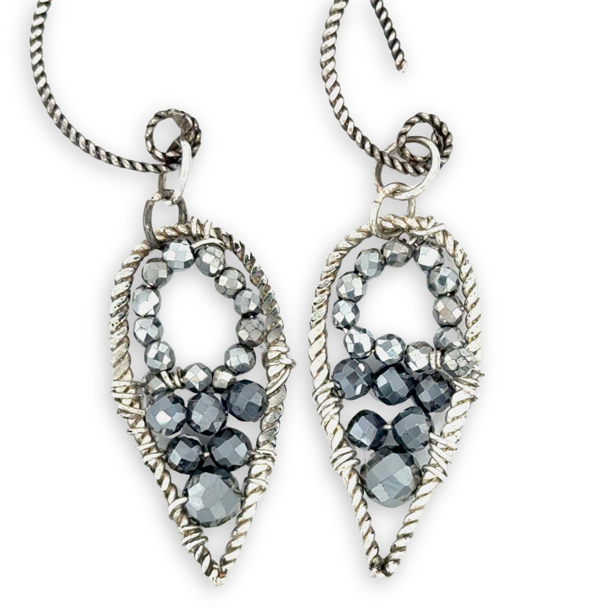 darkened twisted sterling silver mini teardrops filled with pyrite gemstones on our own handmade sterling silver twist hoop earring