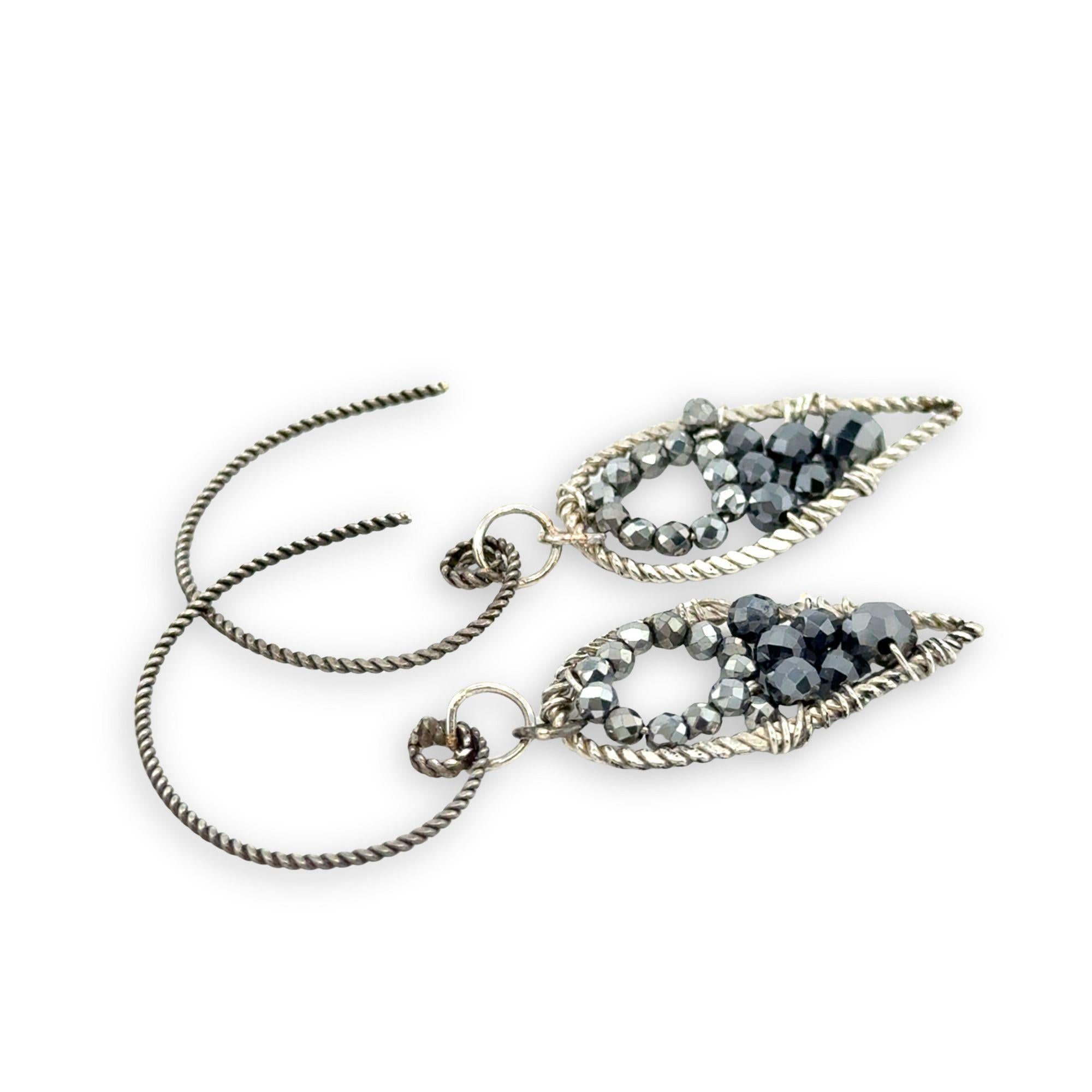 darkened twisted sterling silver mini teardrops filled with pyrite gemstones on our own handmade sterling silver twist hoop earring