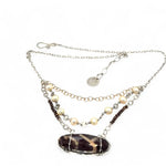 Brown oval jasper held in sterling silver is layered with fresh water pearl, gold filled chain, and pyrite gemstones to form an already layered necklace