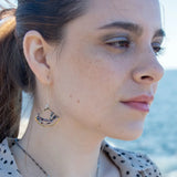 Brass fans suspended by a floral stamped sterling silver paddle with oxidized sterling twist wire, mixed color gemstone, cubic zirconia, and pyrite faceted gemstones