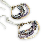 Brass fans suspended by a floral stamped sterling silver paddle with oxidized sterling twist wire, mixed color gemstone, cubic zirconia, and pyrite faceted gemstones