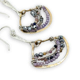 Brass fans suspended by a floral stamped sterling silver paddle with oxidized sterling twist wire, mixed color gemstone, cubic zirconia, and pyrite faceted gemstones