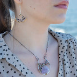 Brass fans suspended by a floral stamped sterling silver paddle with oxidized sterling twist wire, mixed color gemstone, cubic zirconia, and pyrite faceted gemstones