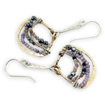 Brass fans suspended by a floral stamped sterling silver paddle with oxidized sterling twist wire, mixed color gemstone, cubic zirconia, and pyrite faceted gemstones