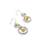 darkened sterling silver twist rings with citrine orbs hanging in them, swinging from sterling silver hammered polygons with prehnite and green cubic zirconia gemstone earrings