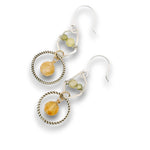 darkened sterling silver twist rings with citrine orbs hanging in them, swinging from sterling silver hammered polygons with prehnite and green cubic zirconia gemstone earrings