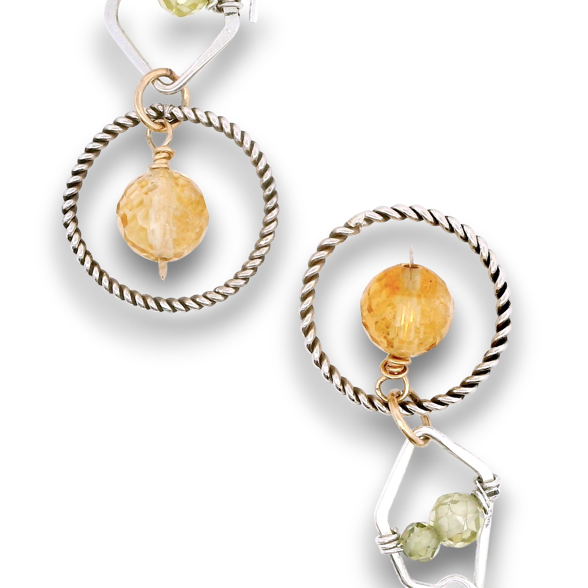 darkened sterling silver twist rings with citrine orbs hanging in them, swinging from sterling silver hammered polygons with prehnite and green cubic zirconia gemstone earrings