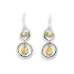 darkened sterling silver twist rings with citrine orbs hanging in them, swinging from sterling silver hammered polygons with prehnite and green cubic zirconia gemstone earrings
