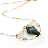 brass semi circle pendant holding moonstone and a large diamond chrysocolla gemstones in gold filled wire on a gold fill chain necklace