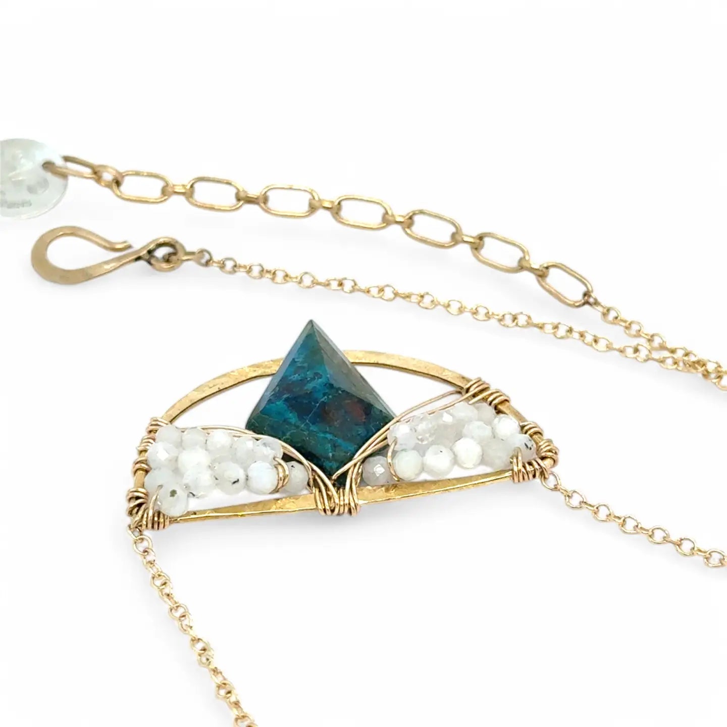 brass semi circle pendant holding moonstone and a large diamond chrysocolla gemstones in gold filled wire on a gold fill chain necklace