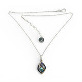 A mini sterling silver marquise pendant with abalone shell tile, purple crystal, and cubic zirconia on a sterling silver sparkle chain necklace