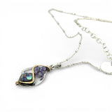 A mini sterling silver marquise pendant with abalone shell tile, purple crystal, and cubic zirconia on a sterling silver sparkle chain necklace