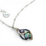 A mini sterling silver marquise pendant with abalone shell tile, purple crystal, and cubic zirconia on a sterling silver sparkle chain necklace