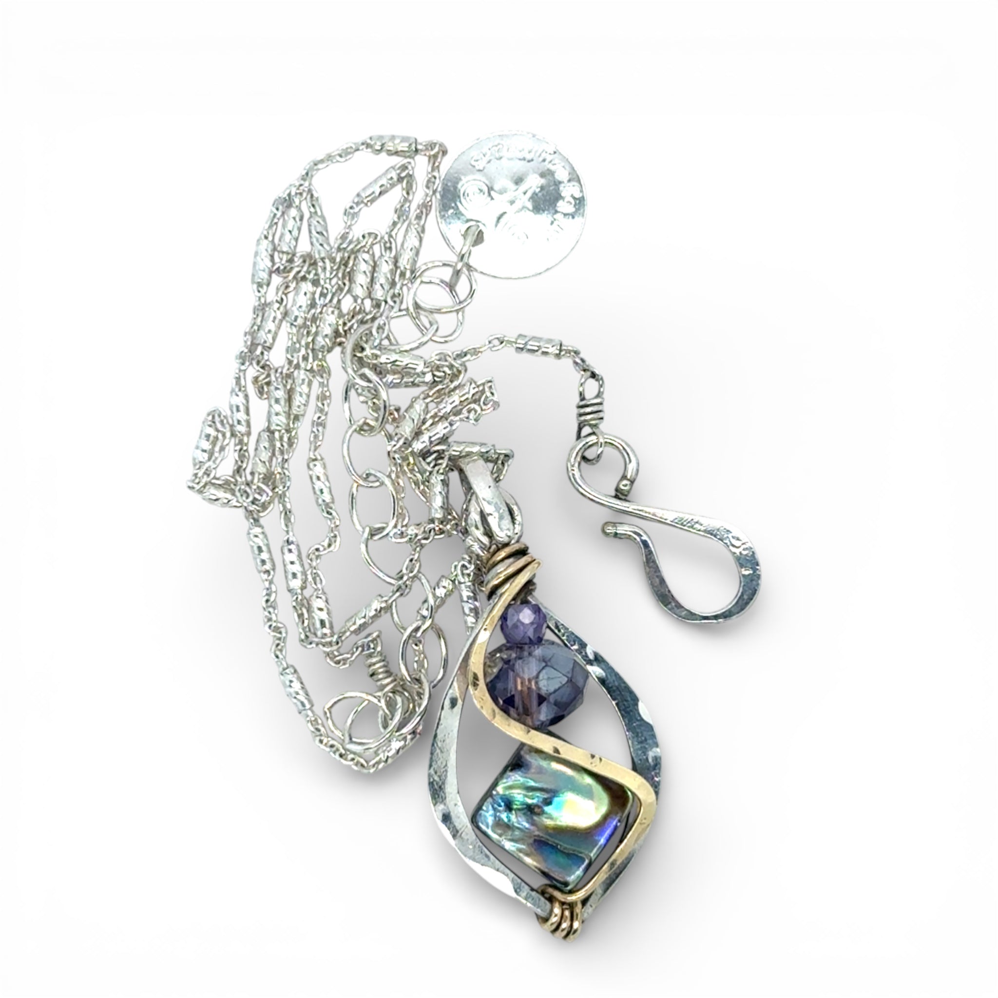 A mini sterling silver marquise pendant with abalone shell tile, purple crystal, and cubic zirconia on a sterling silver sparkle chain necklace