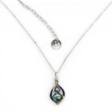 A mini sterling silver marquise pendant with abalone shell tile, purple crystal, and cubic zirconia on a sterling silver sparkle chain necklace