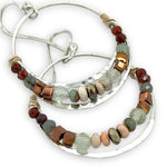 Sterling silver channel hoop earrings with a line of opal, pyrite, green amethyst, and hessonite garnet gemstones on gold filled wire