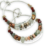 Sterling silver channel hoop earrings with a line of opal, pyrite, green amethyst, and hessonite garnet gemstones on gold filled wire