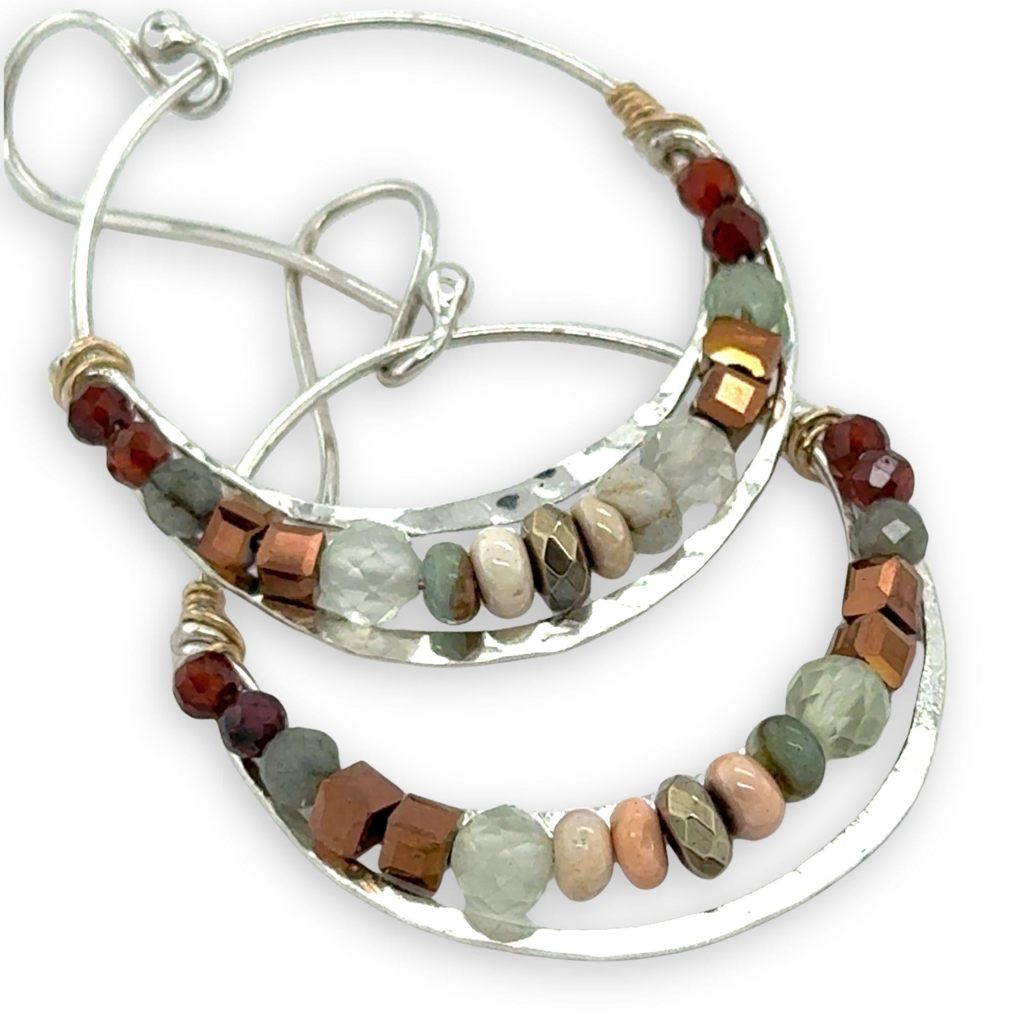 Sterling silver channel hoop earrings with a line of opal, pyrite, green amethyst, and hessonite garnet gemstones on gold filled wire