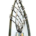 blue green crystal cone inside a brass chapel shaped earring woven with sterling silver fine wire