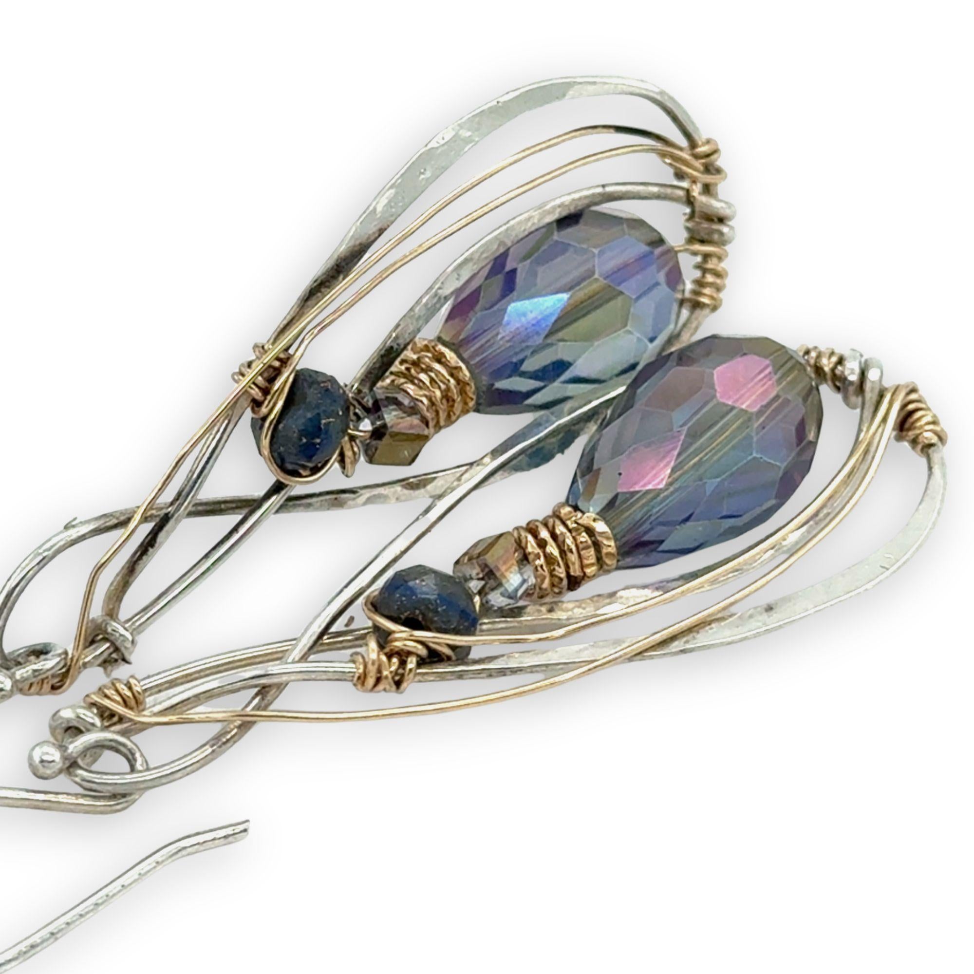 Blue crystal with lapis gemstone on a sterling silver infinity shape earrings accented with gold filled wire