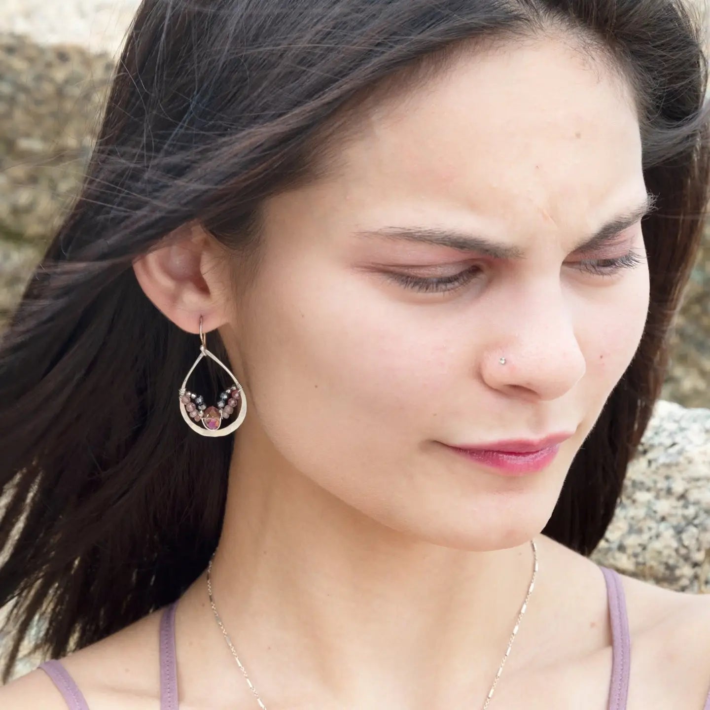 A pair of sterling silver hammered drop earrings with micro faceted pink tourmaline and pyrite gemstones, featuring a pink crystal at the center
