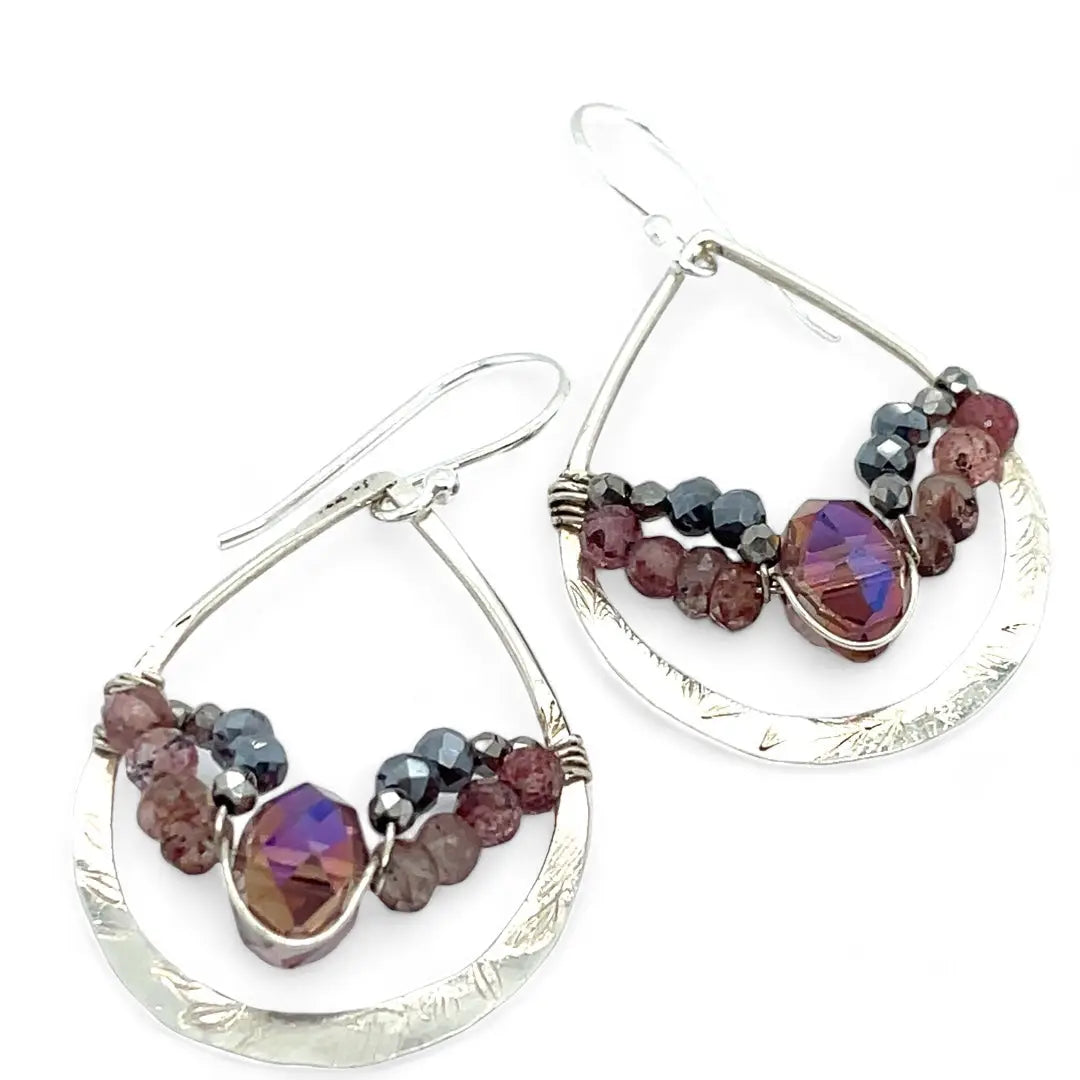 A pair of sterling silver hammered drop earrings with micro faceted pink tourmaline and pyrite gemstones, featuring a pink crystal at the center