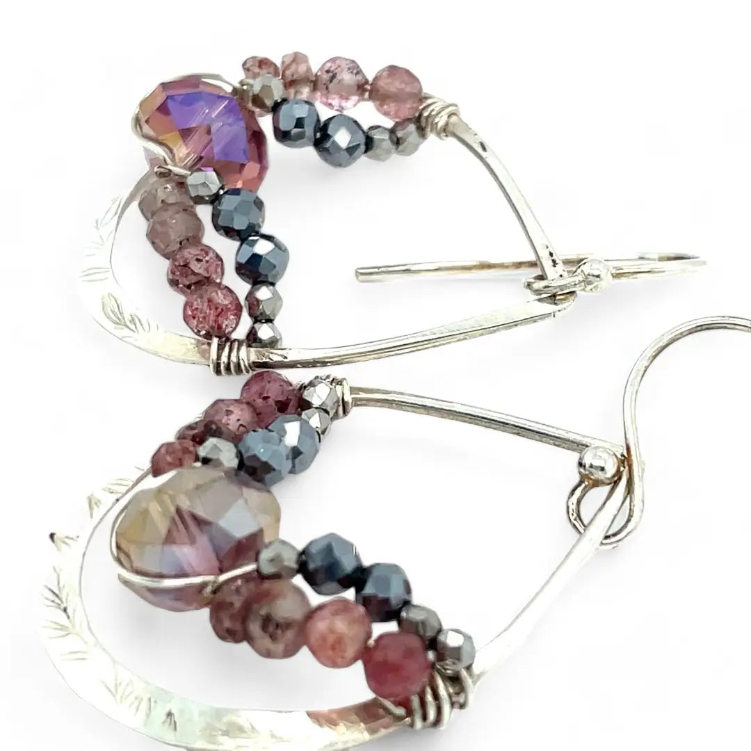A pair of sterling silver hammered drop earrings with micro faceted pink tourmaline and pyrite gemstones, featuring a pink crystal at the center