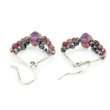 A pair of sterling silver hammered drop earrings with micro faceted pink tourmaline and pyrite gemstones, featuring a pink crystal at the center