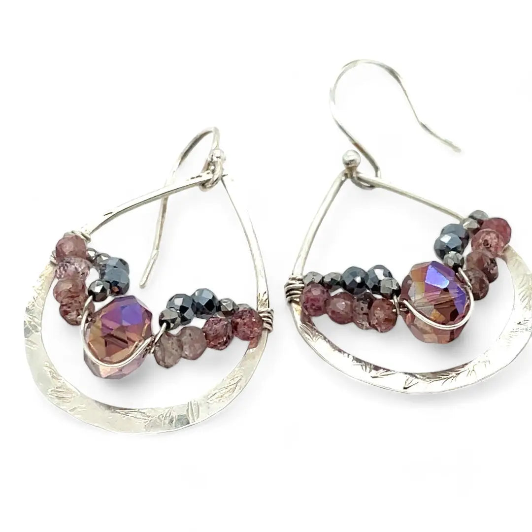 A pair of sterling silver hammered drop earrings with micro faceted pink tourmaline and pyrite gemstones, featuring a pink crystal at the center