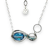 A sterling silver infinity pendant necklace with a twisted silver ring and an adjustable delicate chain. The pendant features apatite faceted gemstone accenting blue crystal.