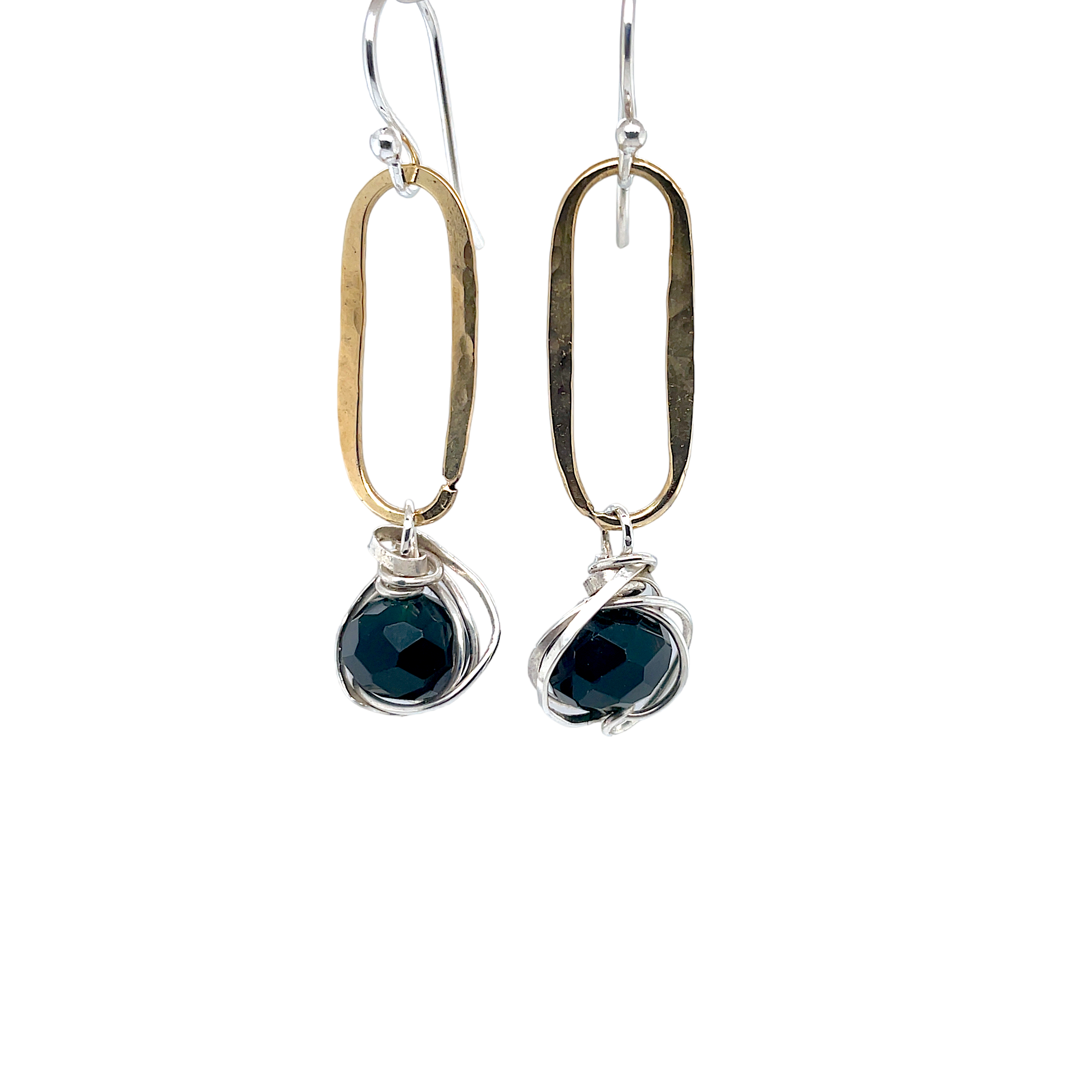 Dark green moss crystal wrapped in sterling silver hangs from a hammered brass oval earrings