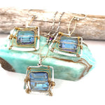 Blue crystal tile lined in brass twist wire layers in a hammered handmade sterling silver box pendant, with crystal cube and gold fill link accents on a sterling silver chain