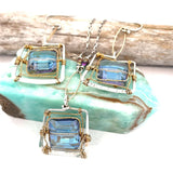 Blue crystal tile lined in brass twist wire layers in a hammered handmade sterling silver box pendant, with crystal cube and gold fill link accents on a sterling silver chain