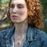 Blue crystal tile lined in brass twist wire layers in a hammered handmade sterling silver box pendant, with crystal cube and gold fill link accents on a sterling silver chain