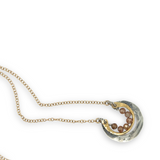 Darkened sterling silver and brass open ring mini pendant with peach cubic zirconia gemstones on gold filled chain necklace