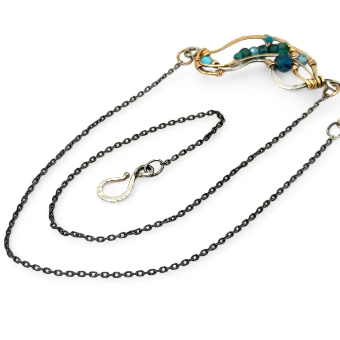 Hammered brass and darkened sterling silver waves pendant necklace filled with apatite and turquoise gemstones on gold filled wire 