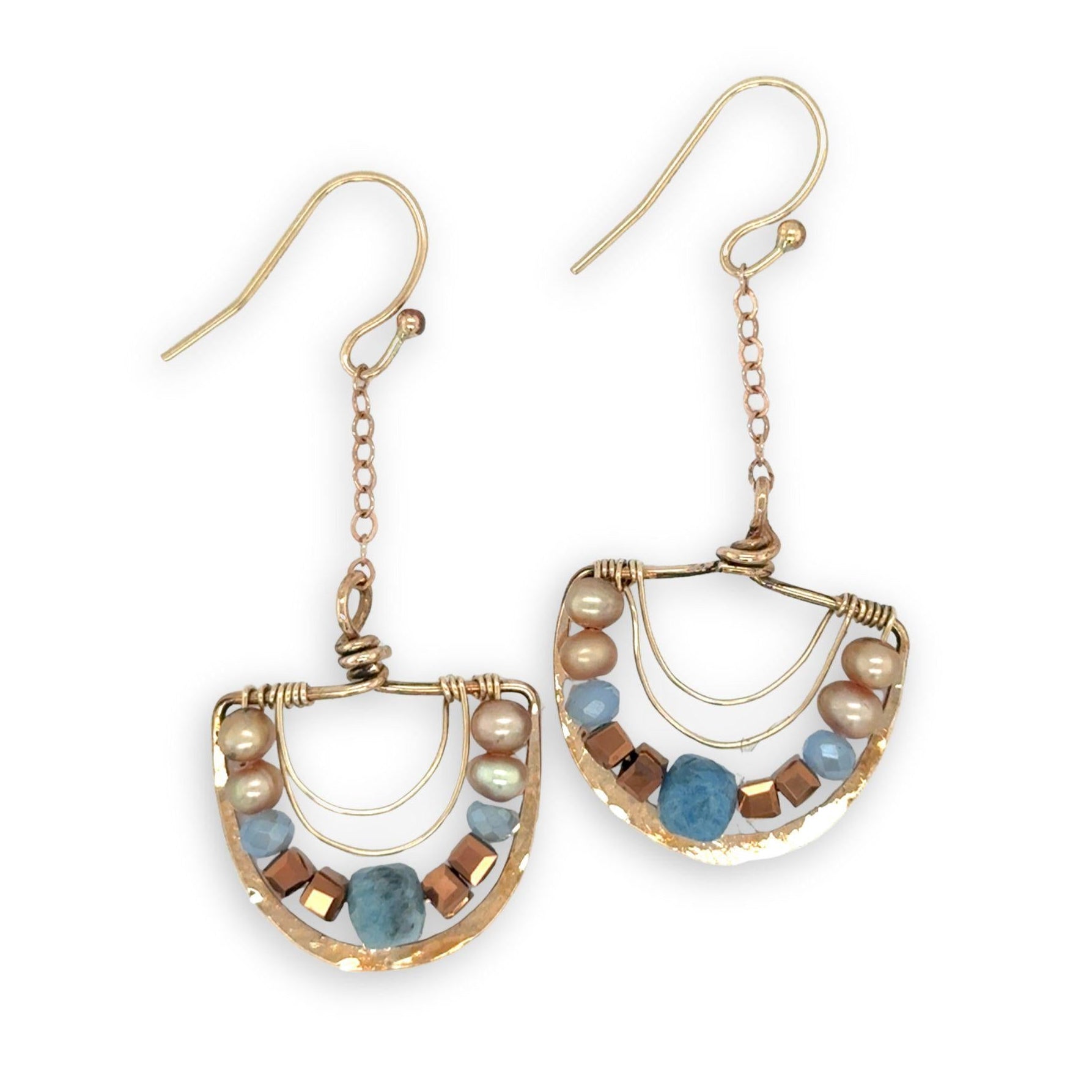 bronze semi circles hanging from find rose gold chain, accented with aquamarine cubes, champagne fresh water pearl, blue crystal and copper crystal cubes