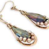 handmade hammered bronze double teardrop earrings with a blue/purple crystal drop lined with champagne fresh water pearls