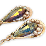 handmade hammered bronze double teardrop earrings with a blue/purple crystal drop lined with champagne fresh water pearls