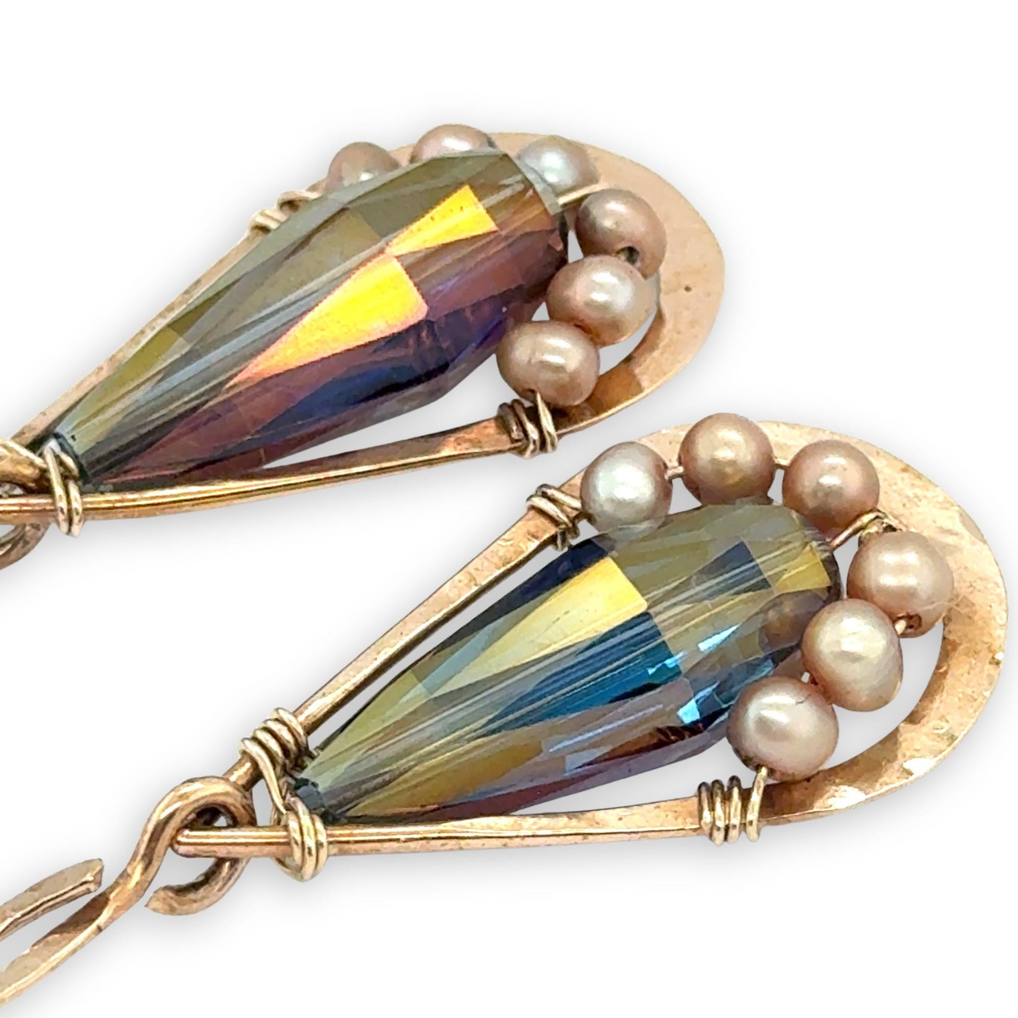 handmade hammered bronze double teardrop earrings with a blue/purple crystal drop lined with champagne fresh water pearls