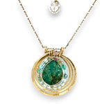 A brass triple circle necklace with turquoise and green fluorite faceted gemstones, featuring an adjustable gold-filled and sterling silver chain 