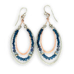 Blue crystal, sodalite, and rich blue quartz gemstones are set between bronze hammered drops and hammered oxidized sterling silver twist earrings