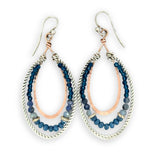 Blue crystal, sodalite, and rich blue quartz gemstones are set between bronze hammered drops and hammered oxidized sterling silver twist earrings