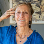 A sterling silver and bronze triple strand chain necklace with blue lapis and sodalite gemstones