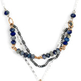 A sterling silver and bronze triple strand chain necklace with blue lapis and sodalite gemstones