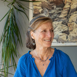 A sterling silver and bronze triple strand chain necklace with blue lapis and sodalite gemstones
