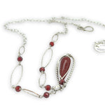 red fire agate drop gemstone held in sterling silver dot wire teardrop pendant necklace with cubic zirconia and sparkly sterling link accents