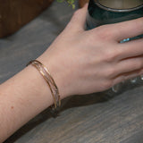 Handmade stamped brass skinny bracelet braided with oxidized sterling silver and gold filled wires