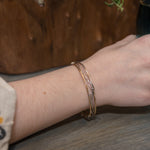 Handmade stamped brass skinny bracelet braided with oxidized sterling silver and gold filled wires