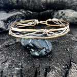 Handmade stamped brass skinny bracelet braided with oxidized sterling silver and gold filled wires
